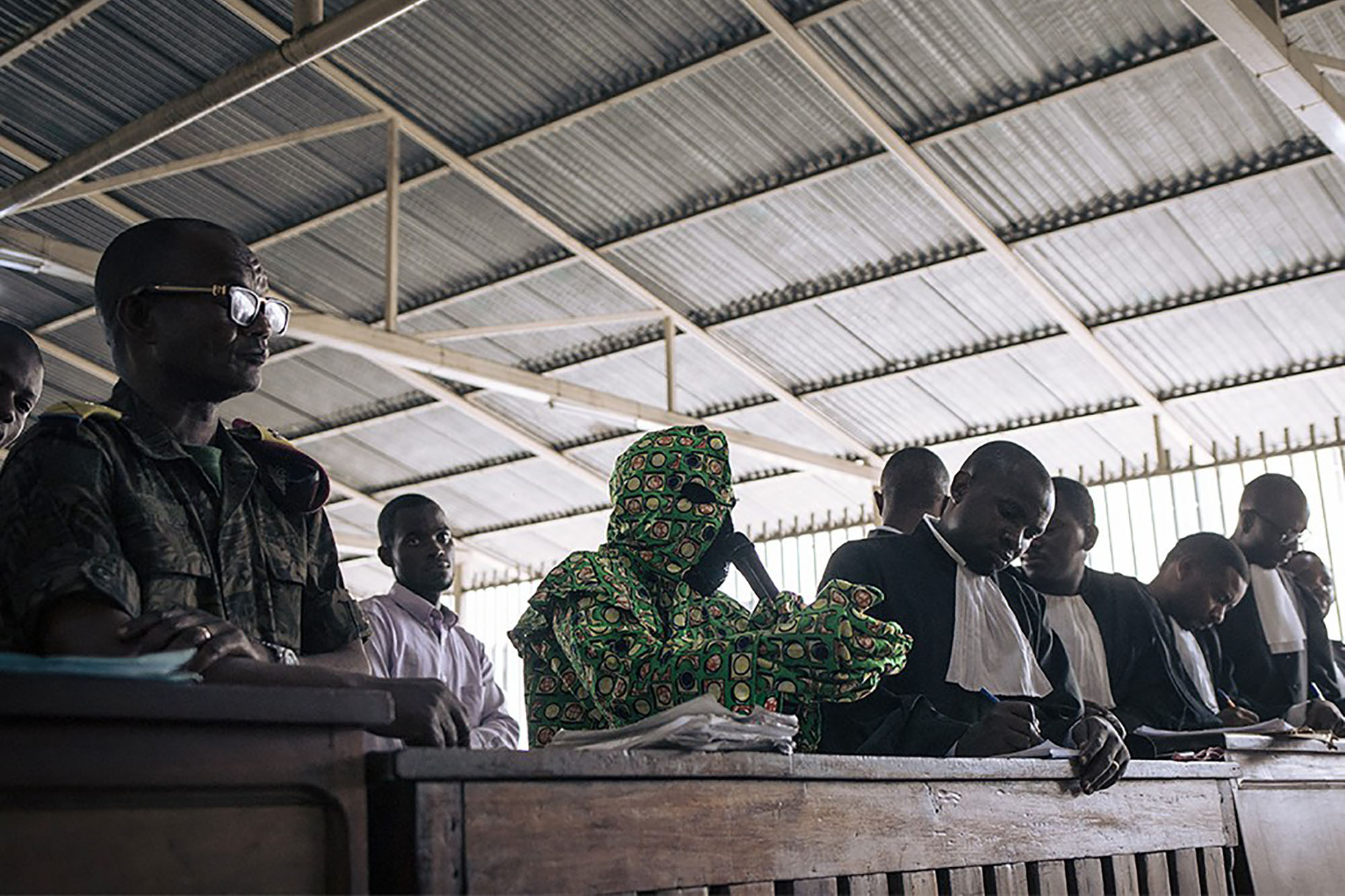 A makeshift open-air courtroom in a village in the Democratic Republic of the Congo.