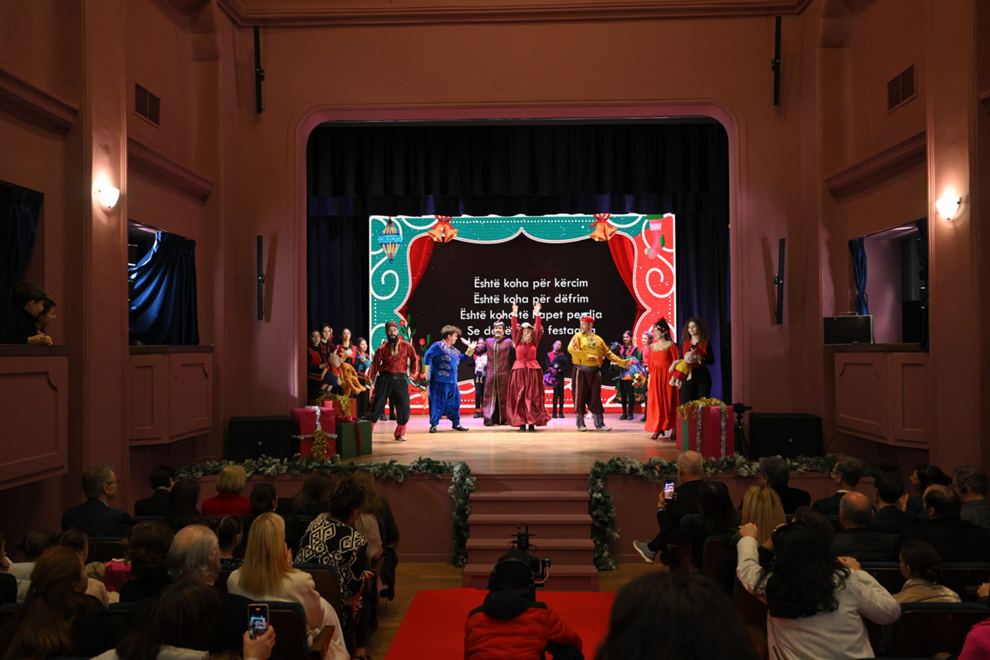 View of the audience and stage of a renovated theatre in Albania.