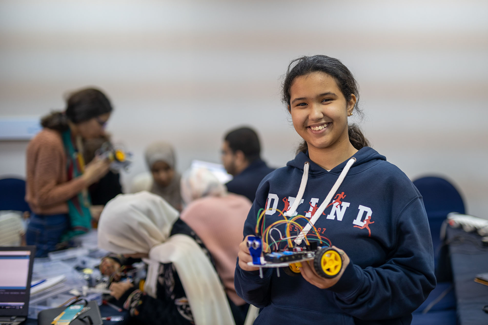 Young girl participating in a Robotics and Coding Workshop hosted by UN Women Regional Office for the Arab States and UNESCO.