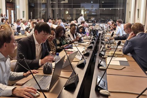 A group of people in a conference. 