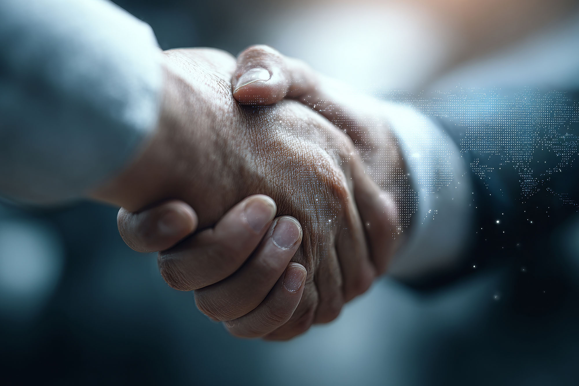 A close-up of two people shaking hands.