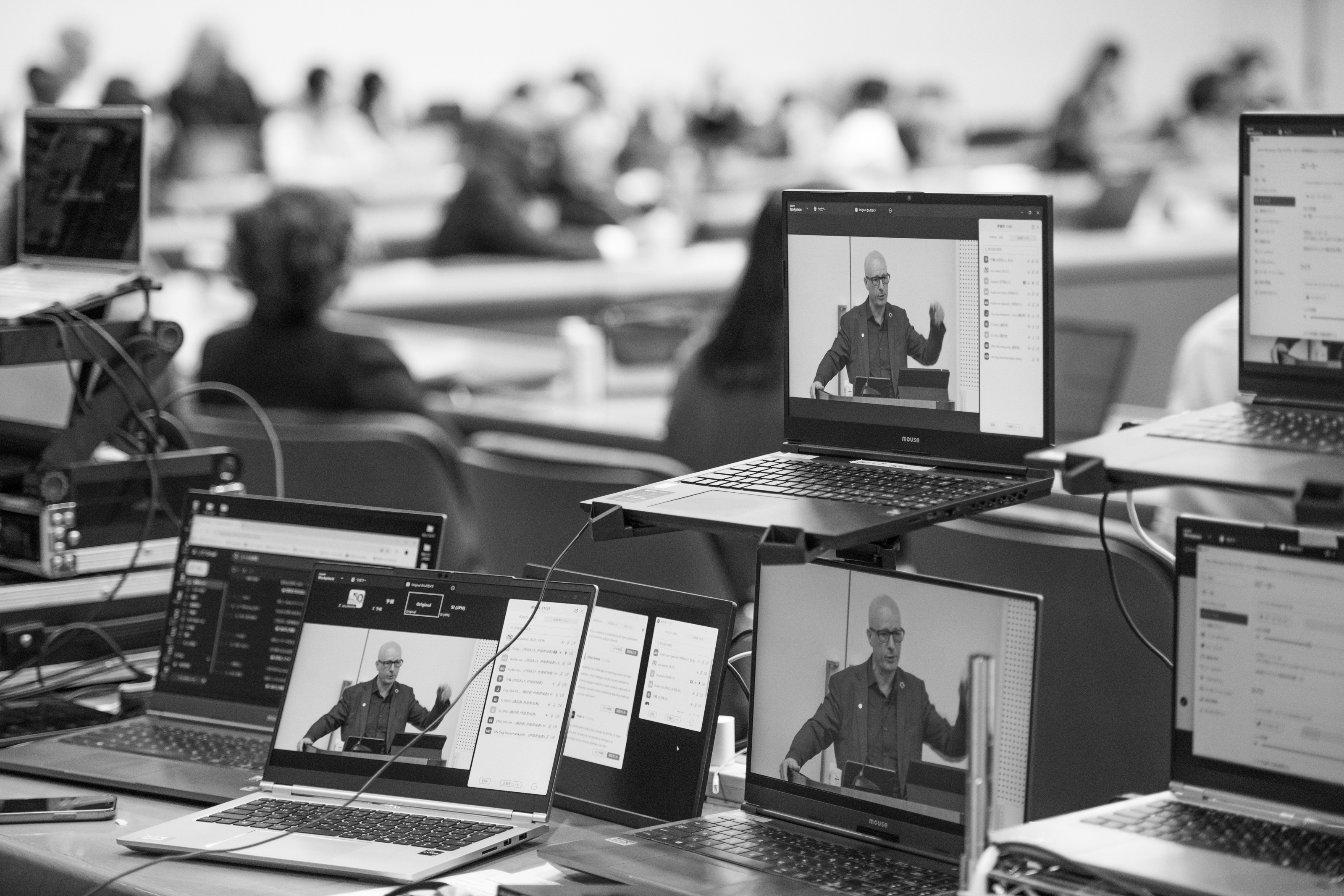 Videographer at work capturing the conference moments.