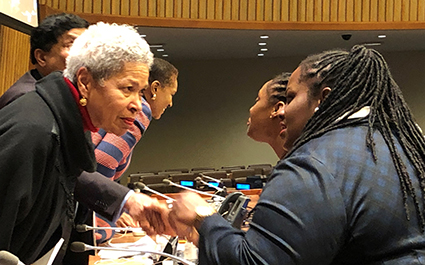 Participants speak with panellists following the discussion