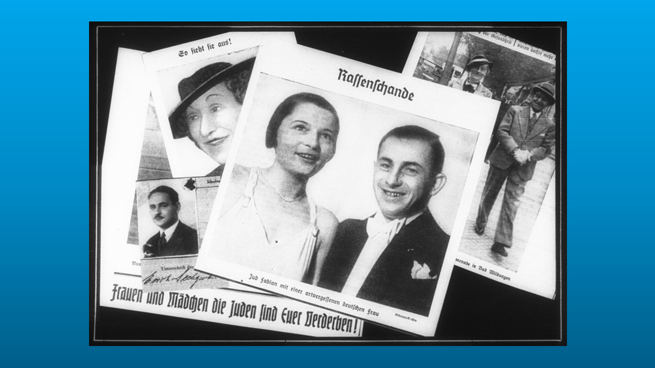 A slide from a Nazi propaganda lecture entitled, “Race Defilement,” showing so-called  “mixed” Jewish and non-Jewish couples, that warned: “Women and Girls, the Jews are your ruin!”