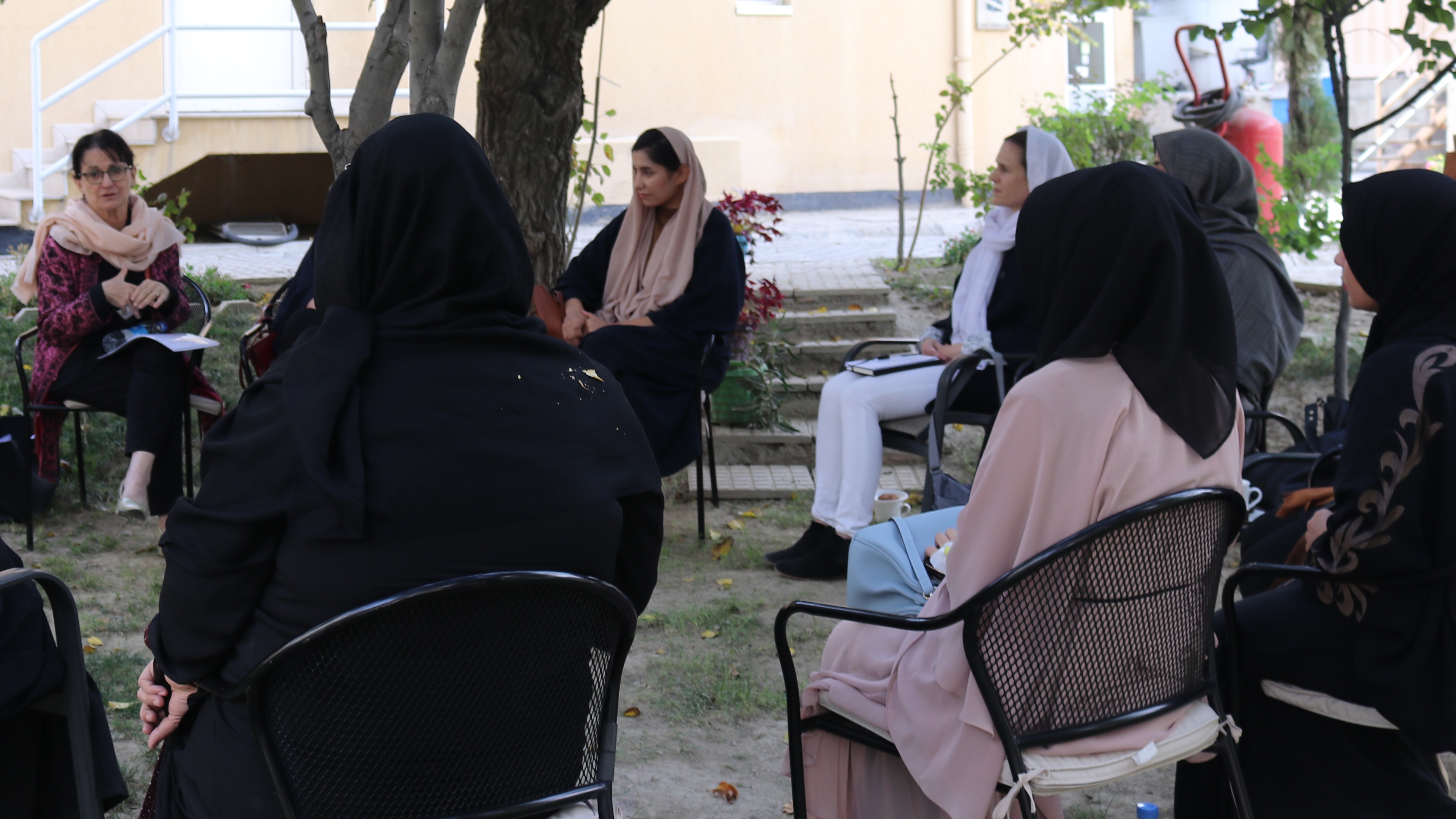 Deborah Lyons, having an informal meeting with female Afghan colleagues