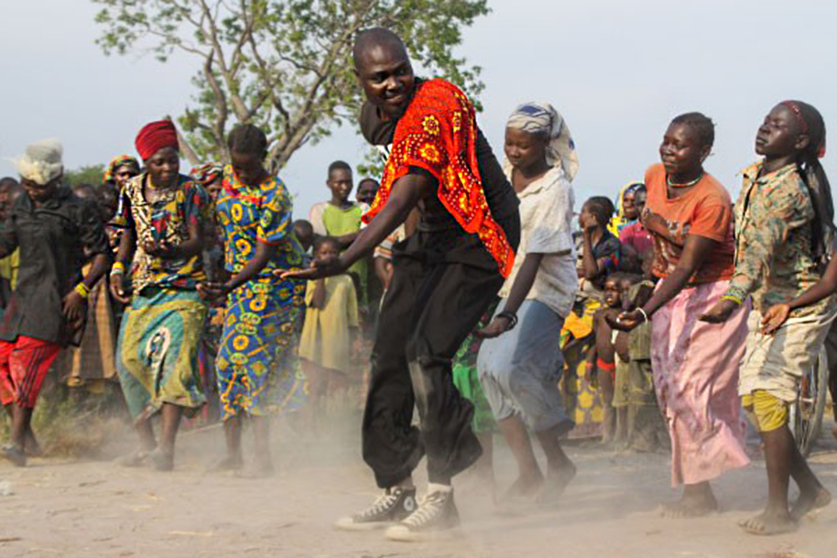 A man leads a group dancing