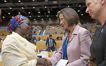 Photo of Ms. Melissa Fleming shaking hands with participant at screening