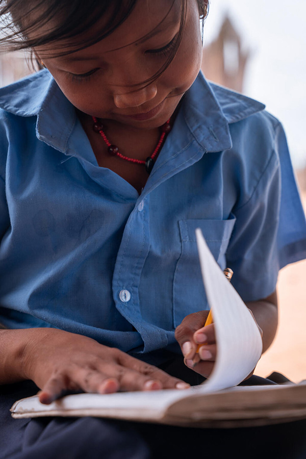 girl writing in notebook