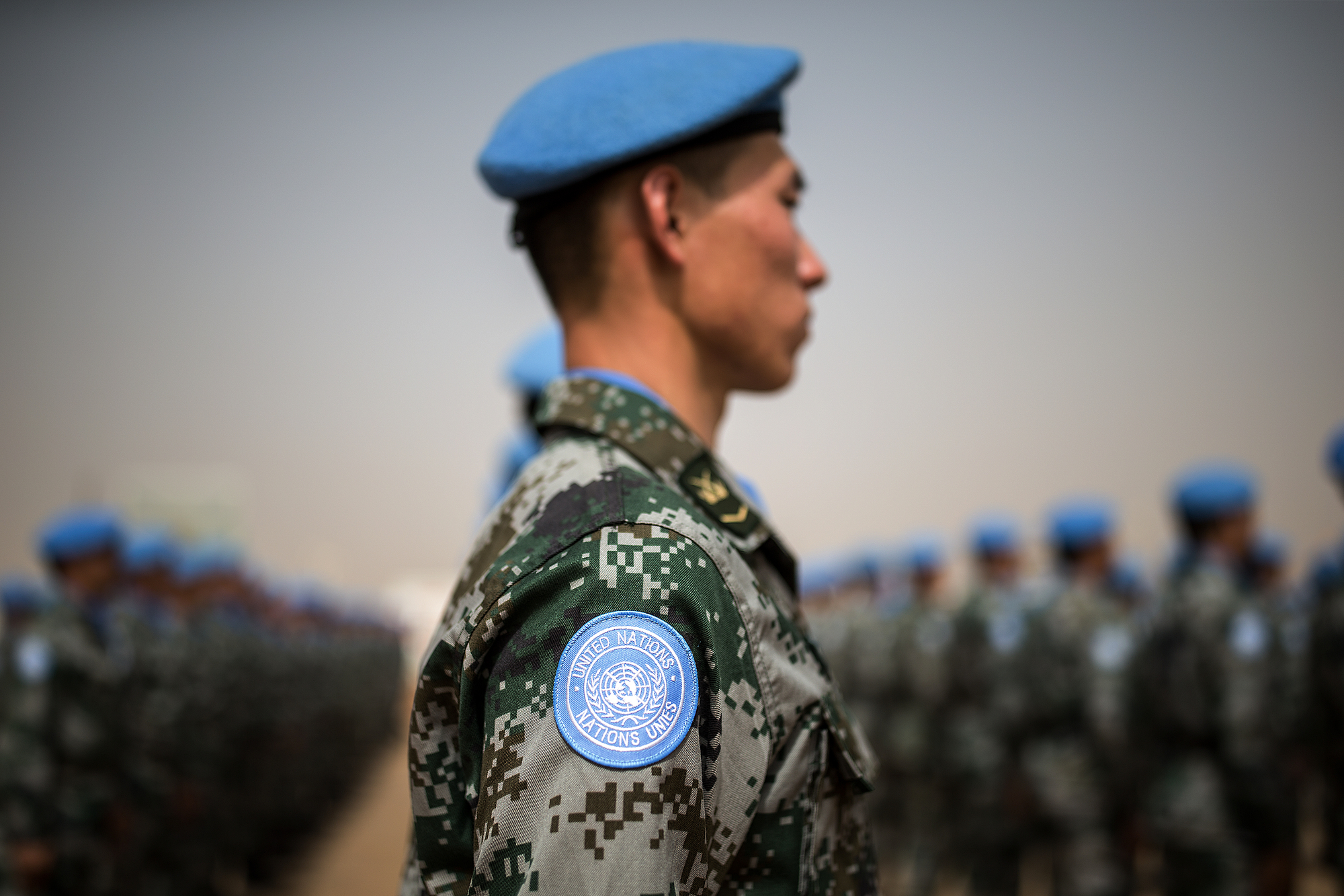 Photo of UN peacekeepers lined up and standing at attention