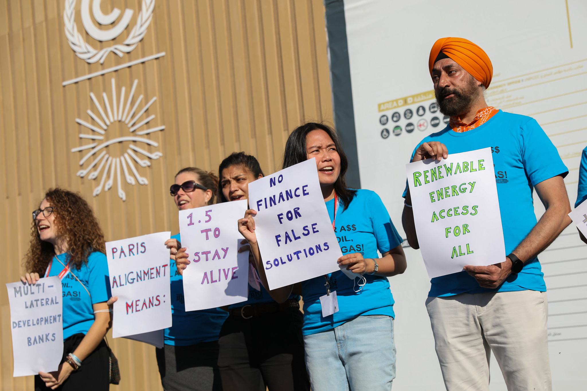 Activists holding banners during a protest in COP27