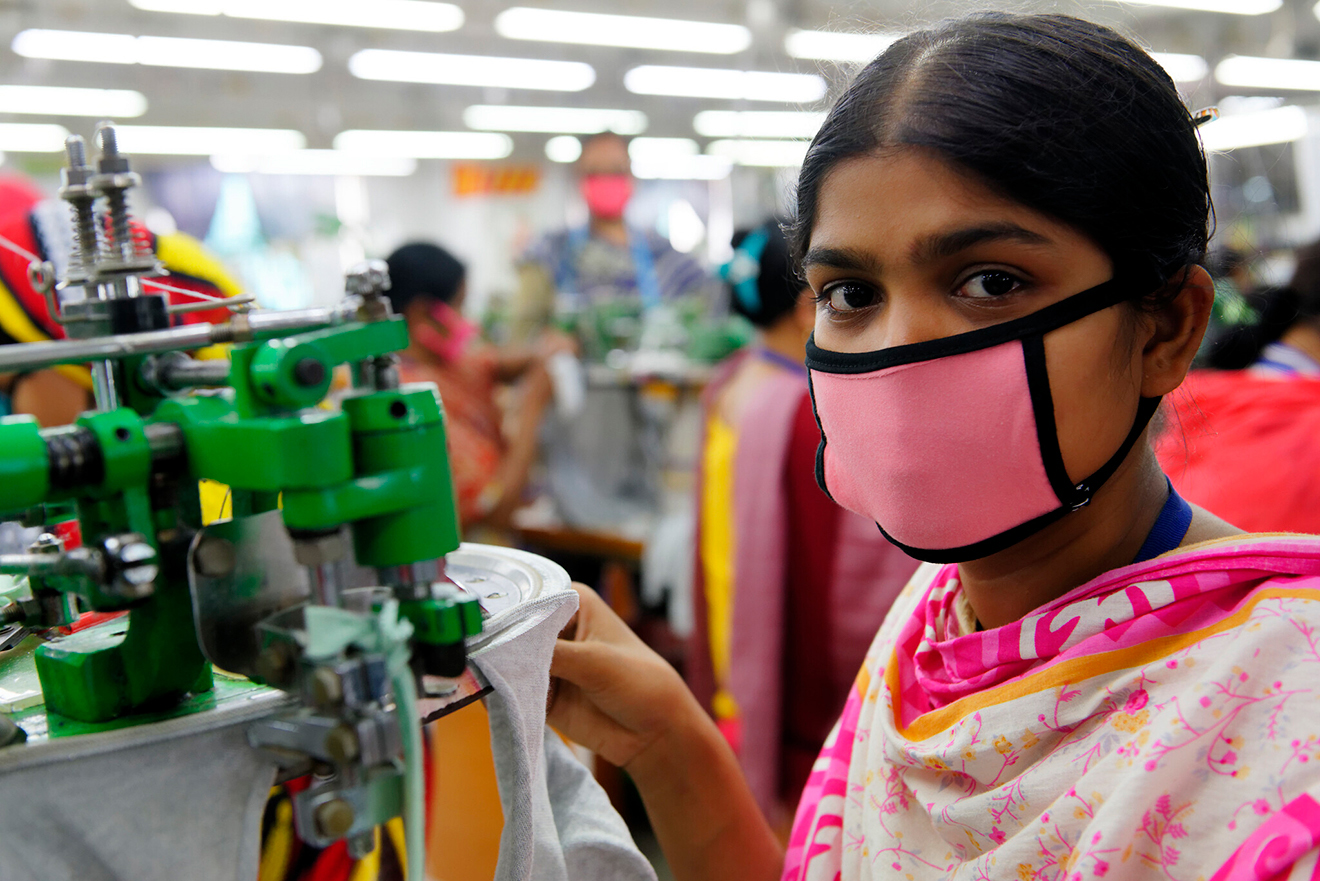 A garment worker wearing a face mask