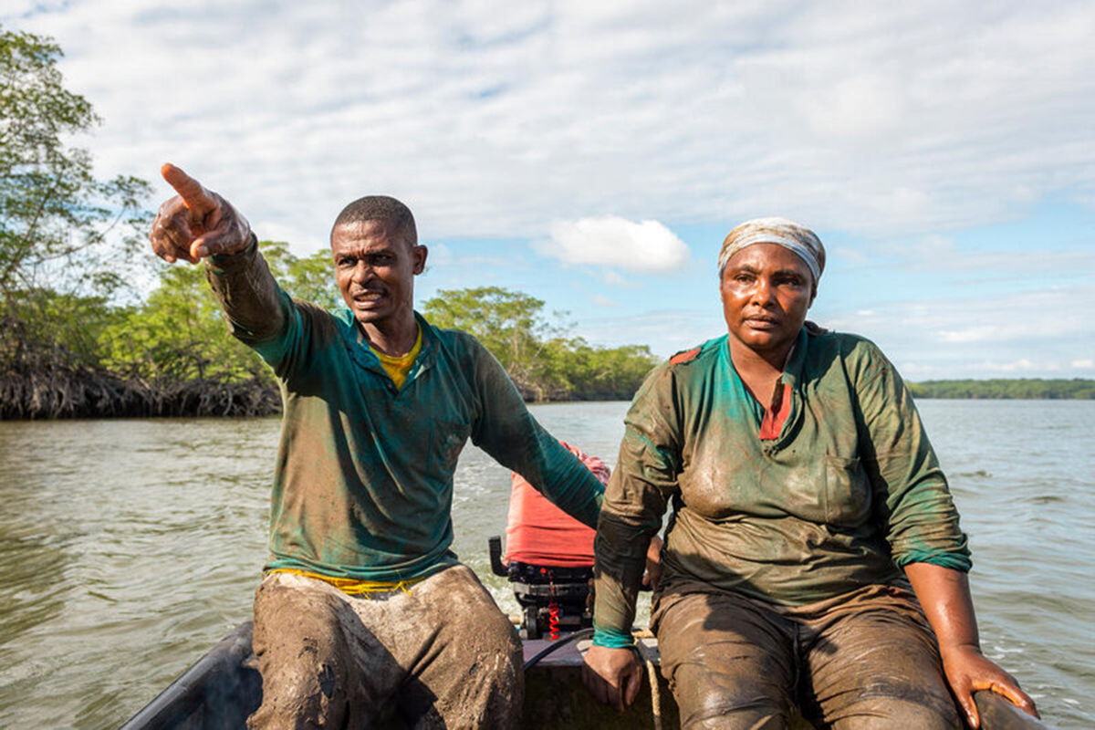 A man and a woman on a motor boat 