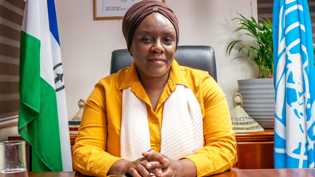 Portrait of Amanda Khozi Mukwashi at her desk in Lesotho