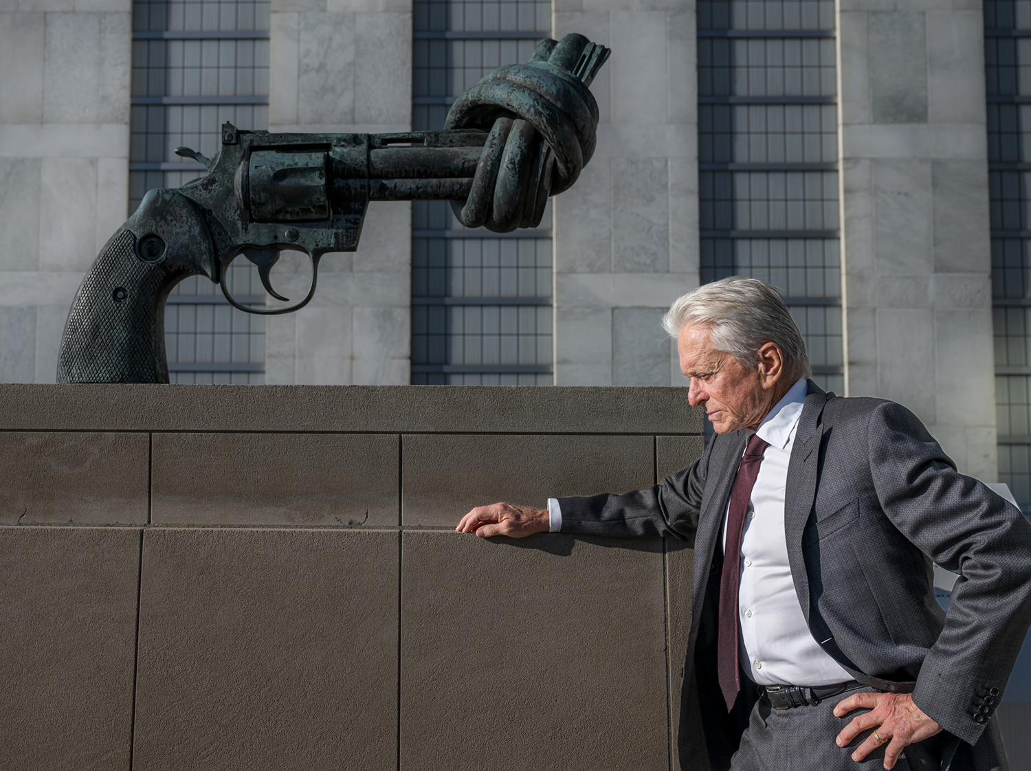 Michael Douglas, United Nations Messenger of Peace, stops by the “Non-Violence” sculpture during his visit to UN Headquarters to attend the International Day of Peace Youth Observance. 
