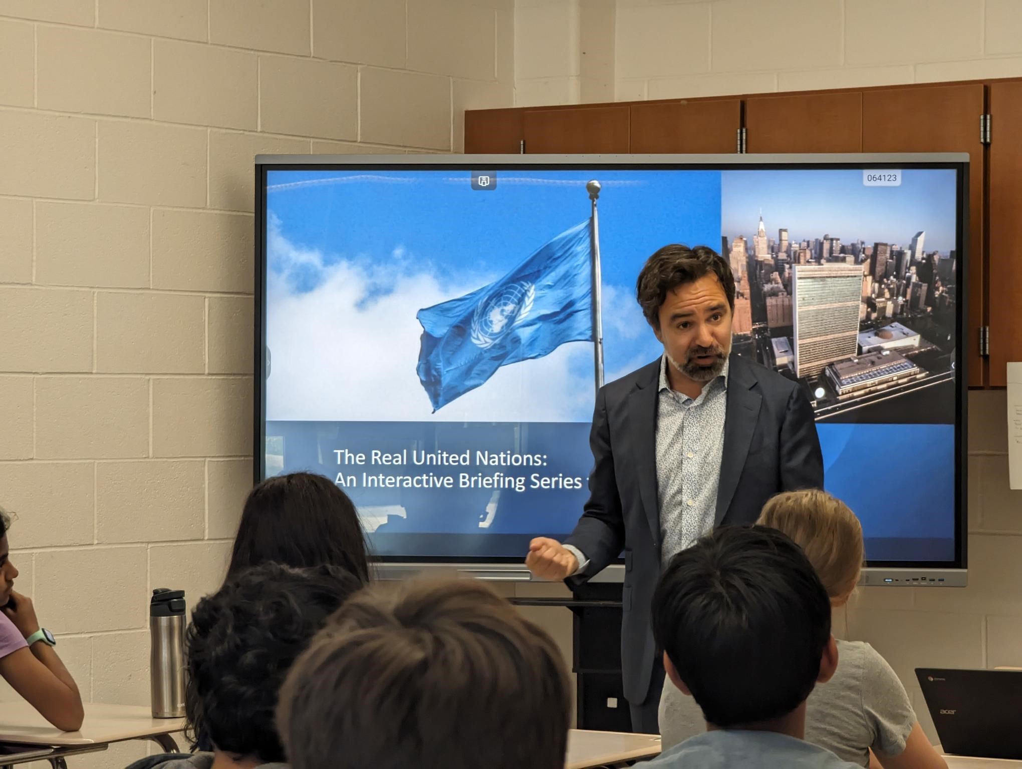 A Diplomat from Saint Vincent and the Grenadines addresses students in a classroom