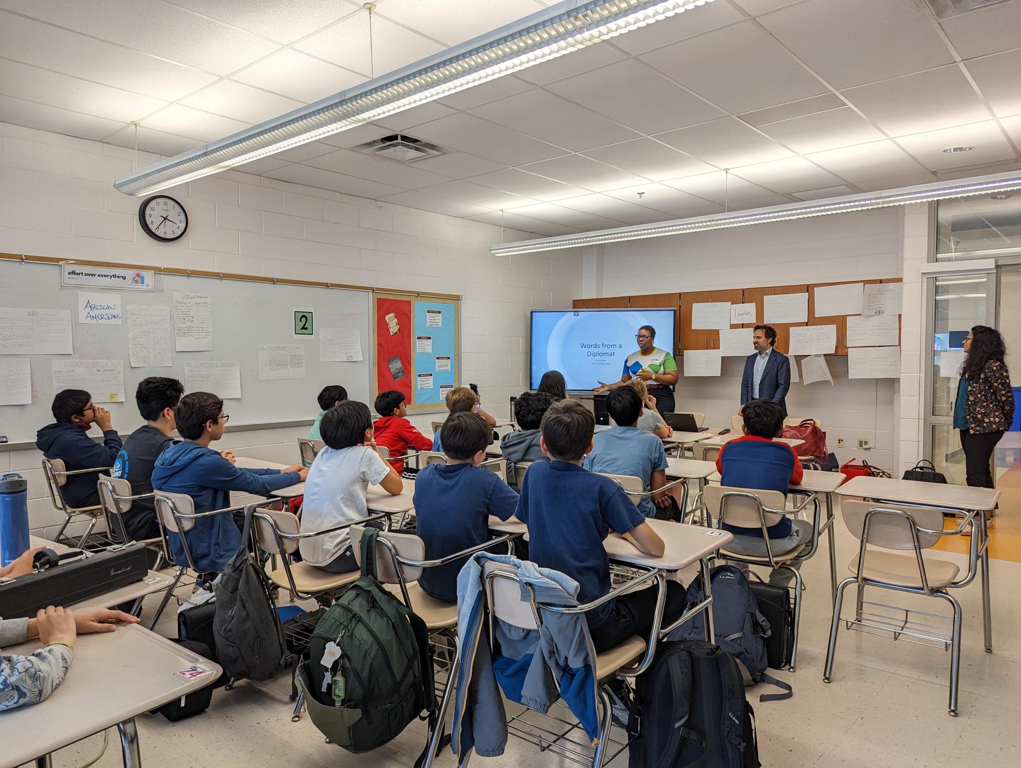 A Diplomat from Saint Vincent and the Grenadines addresses students in a classroom