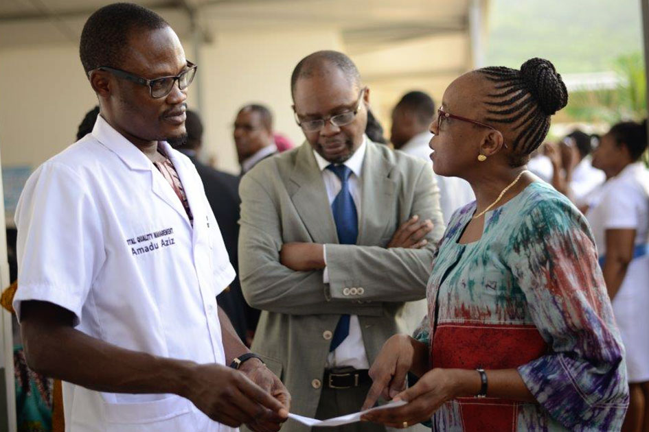 Dr. Moeti is on a field visit in a hospital and is seen in discussion with Mr. Aziz, QA officer.