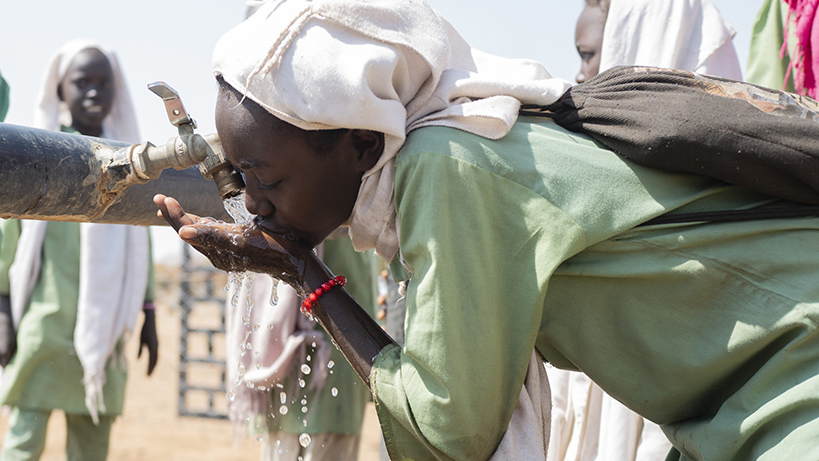 woman at water tap