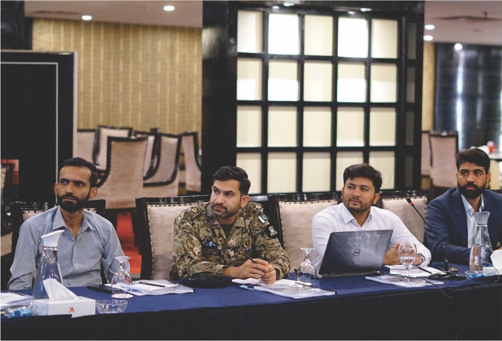 four men at a long table
