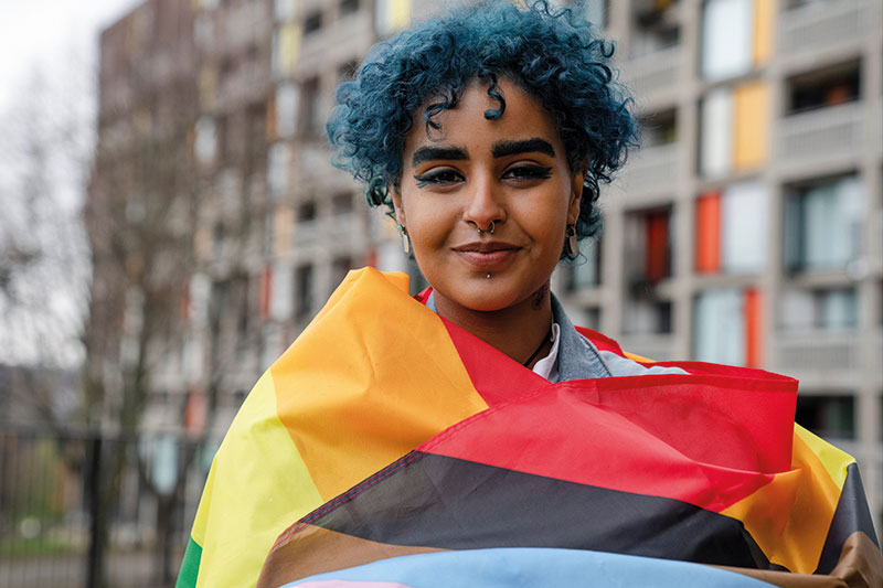 photo of a woman with a rainbow scarf around her neck
