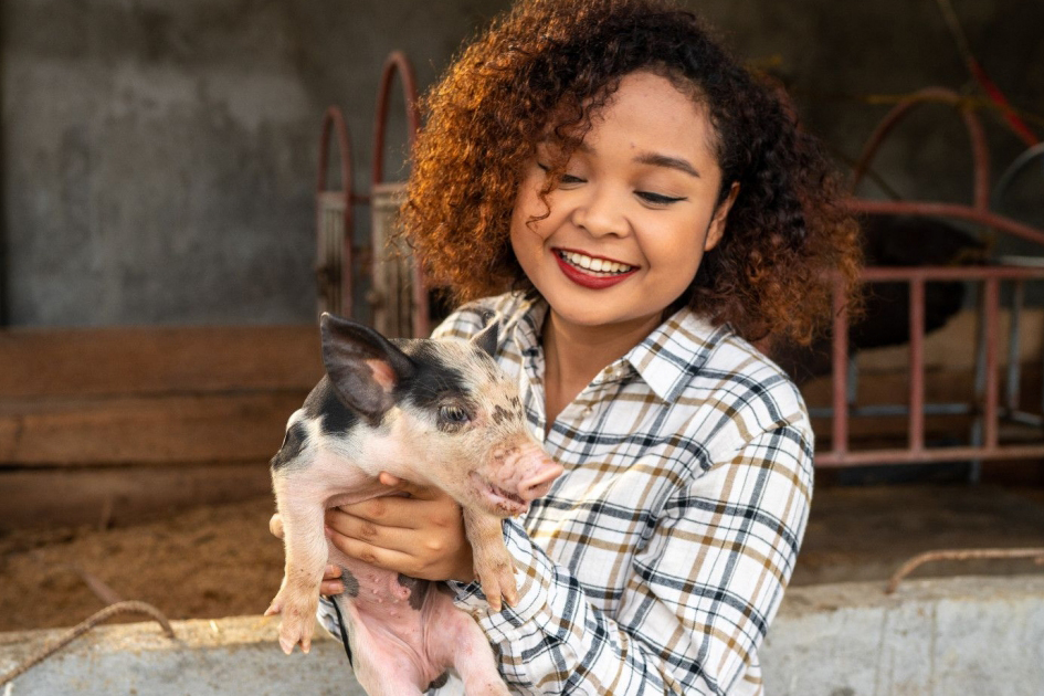 woman with piglet