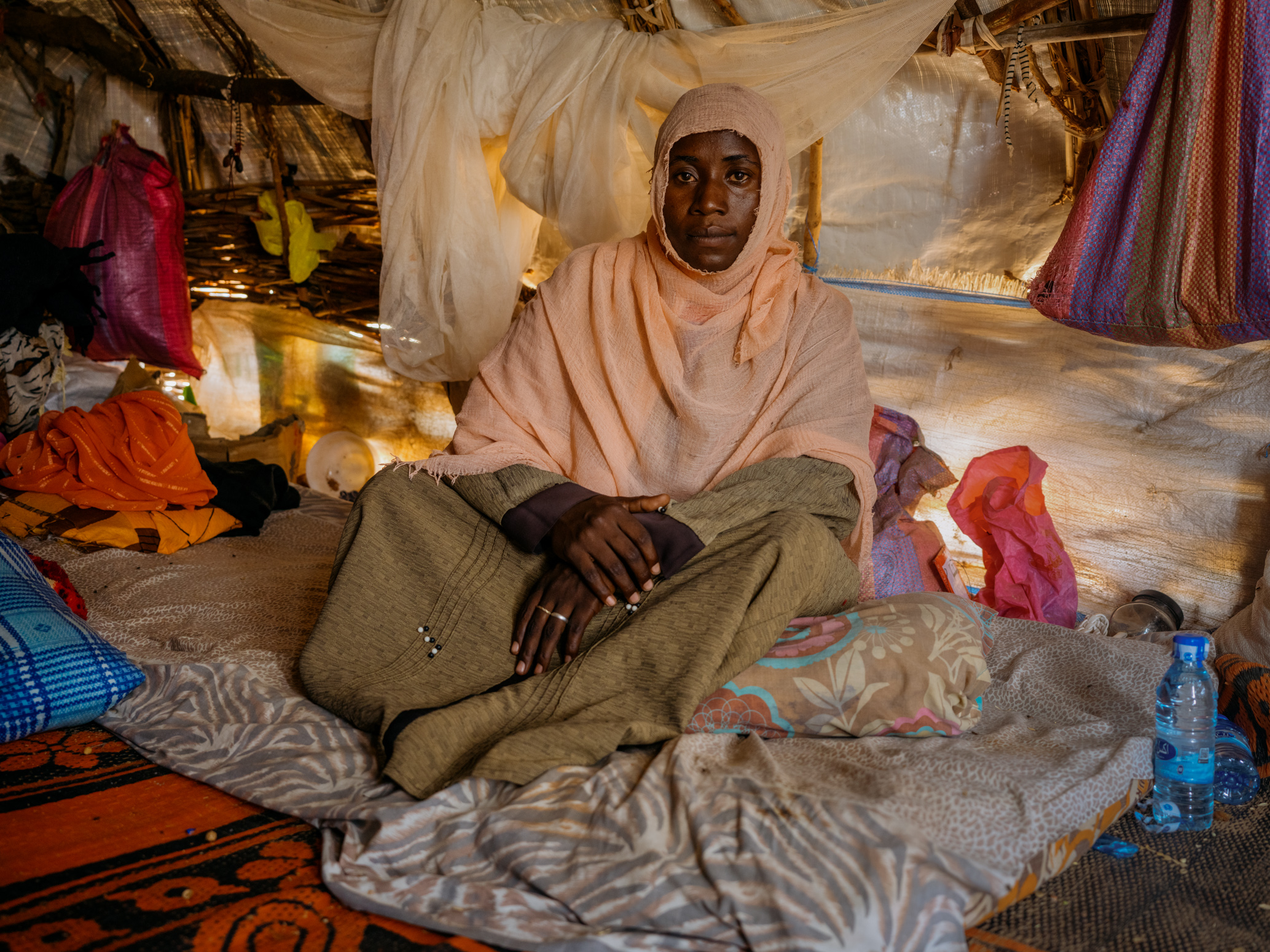 A disabled woman sitting in her tent in Chad