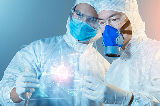 people in PPE holding up see-through tablet