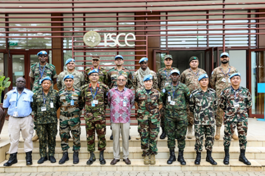 group photo outdoors on the steps to a building