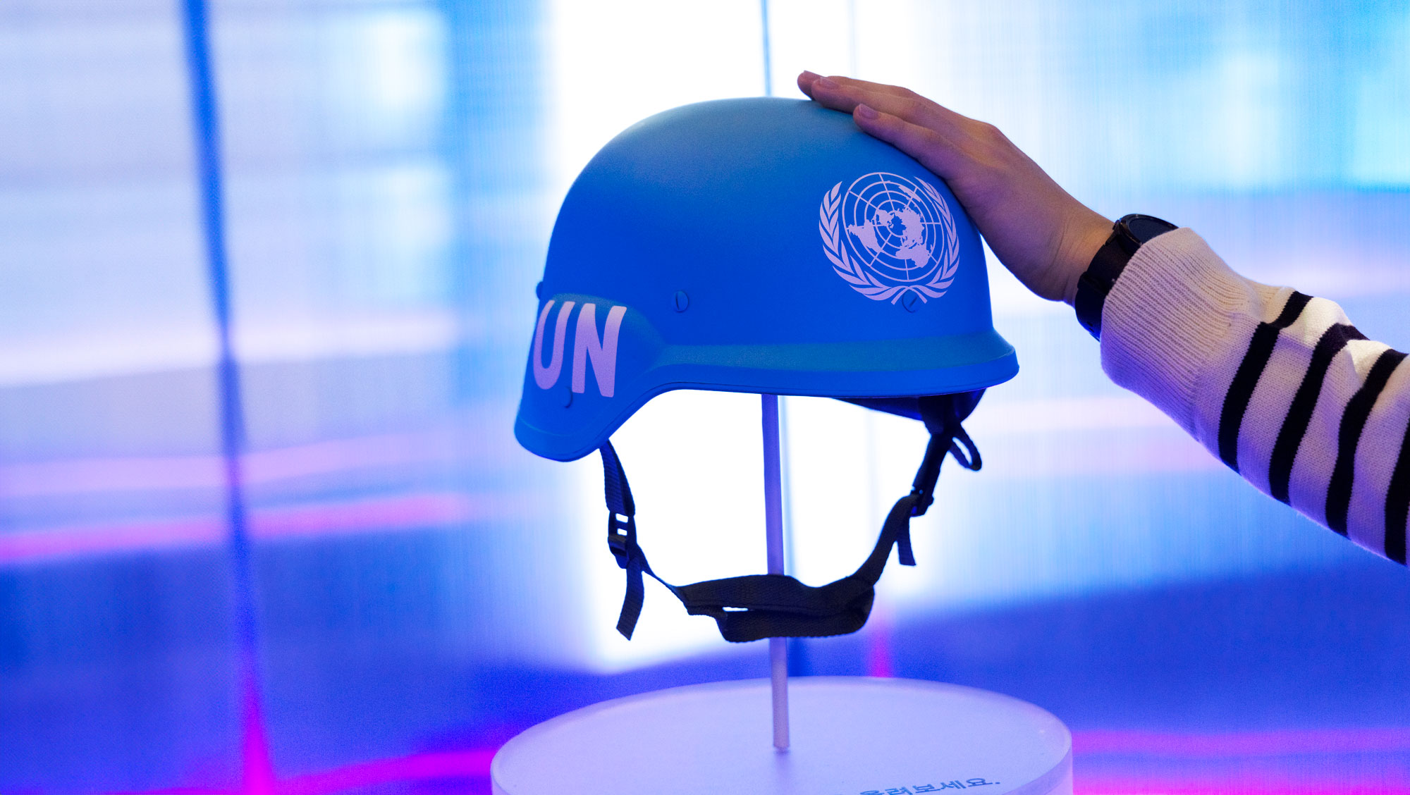 A blue helmet displayed in an exhibit about peacekeeping operations. UN Photo/Hyemi Kim
