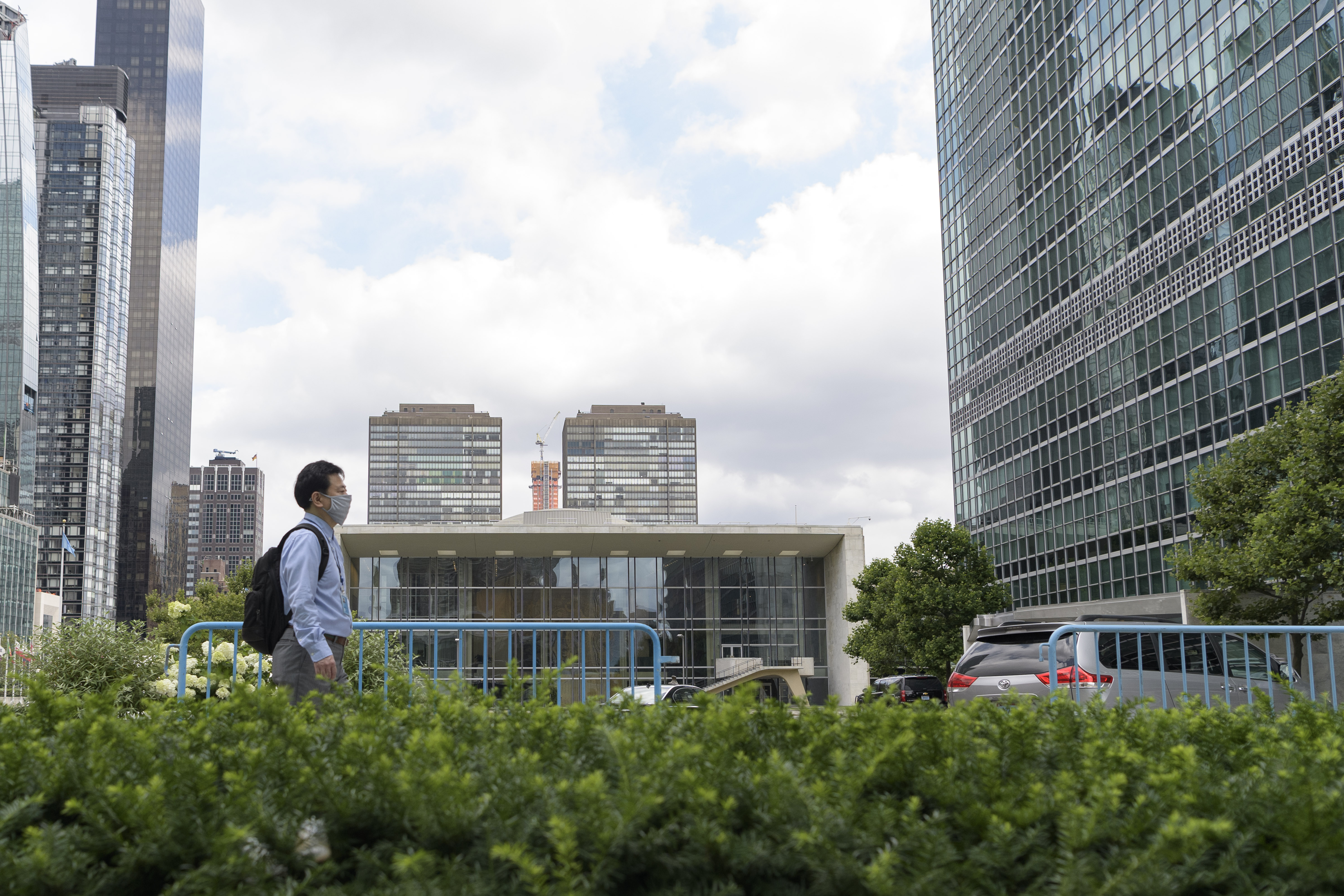 Man walks towards UN Secretariat.