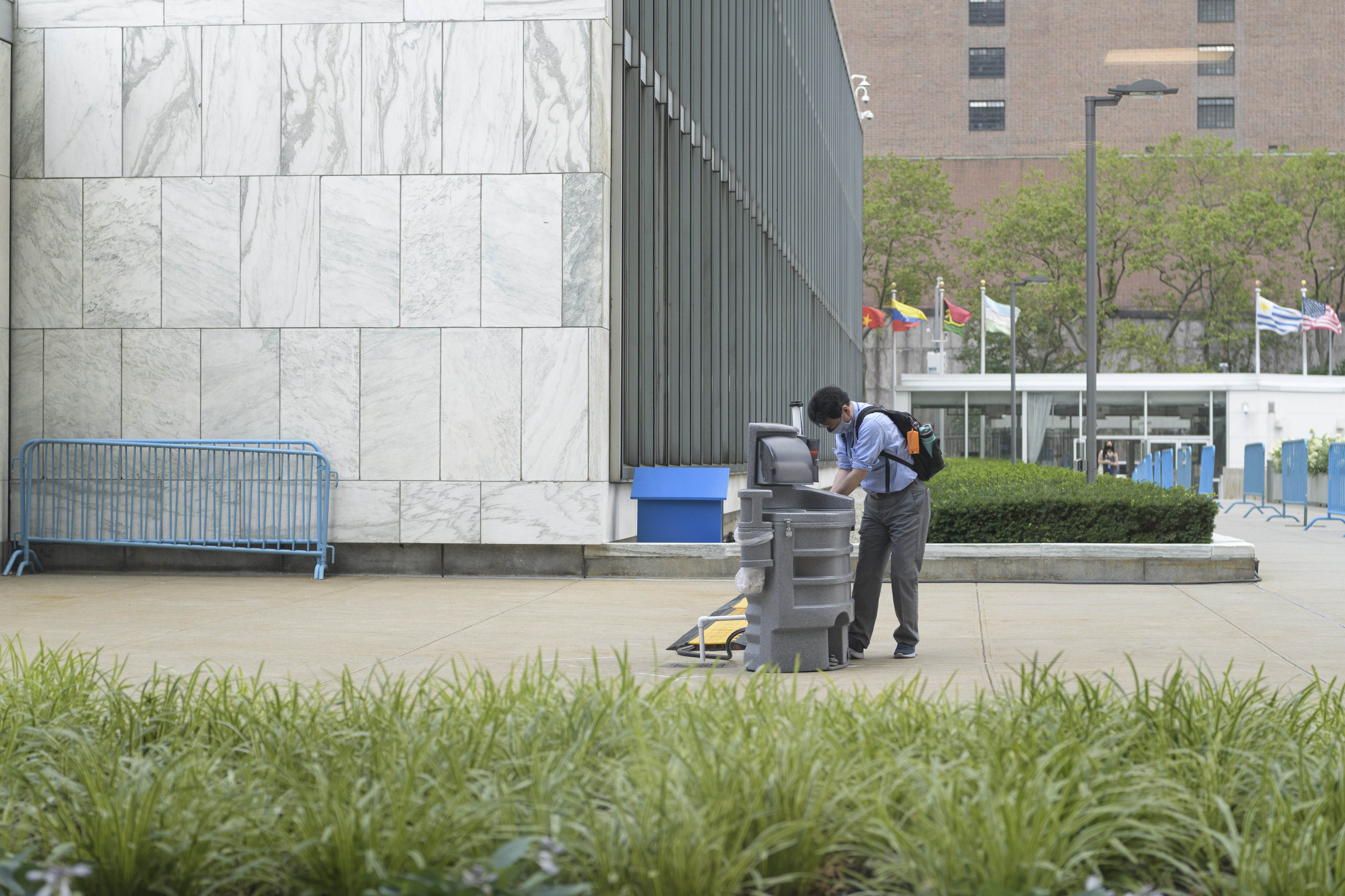 Man stops at a handwashing-station.