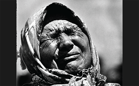 A woman from Srebrenica with a stony face that reflects, better than any words, all the pain and
sorrow of the Srebrenica genocide