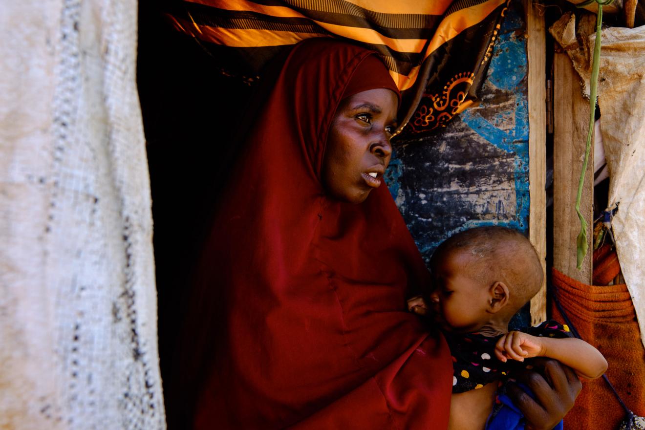 Farhia holding her son