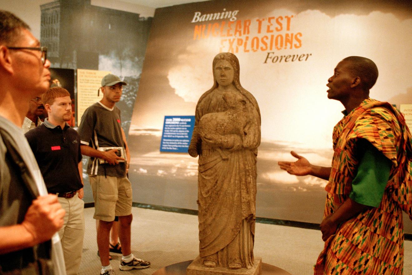 A UN tour guide briefs a group of visitors at the Disarmament Exhibit at the UN Headquarters in New York. Credit: UN Photo
