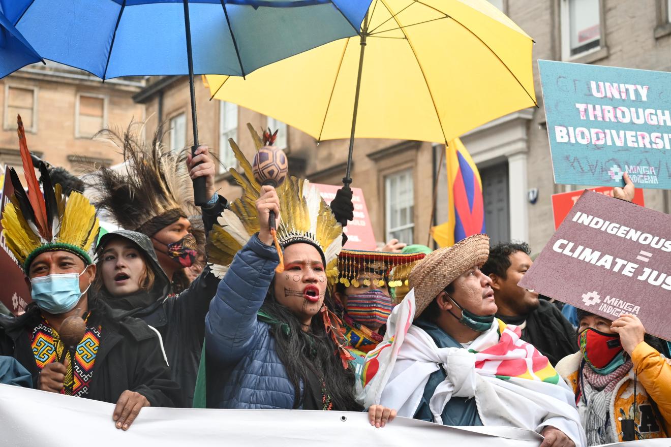 Activistas medioambientales durante una protesta en el COP 26 de Glasgow.