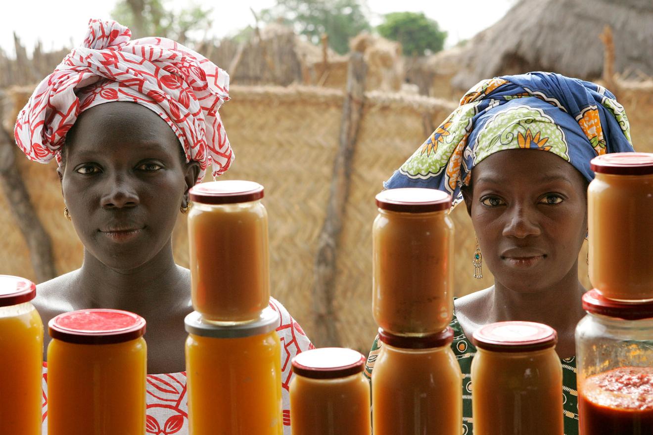 Women sell mango and sweet potato jam at the food processing shop in Bantantinnting, Senegal.