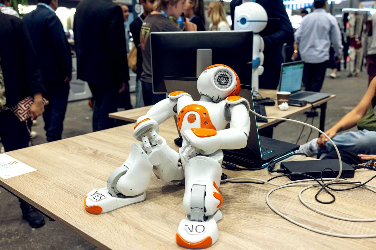 medium size robot reclining on a desk