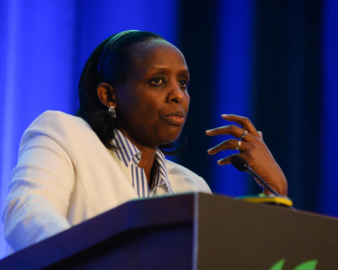 Woman speaking at a podium