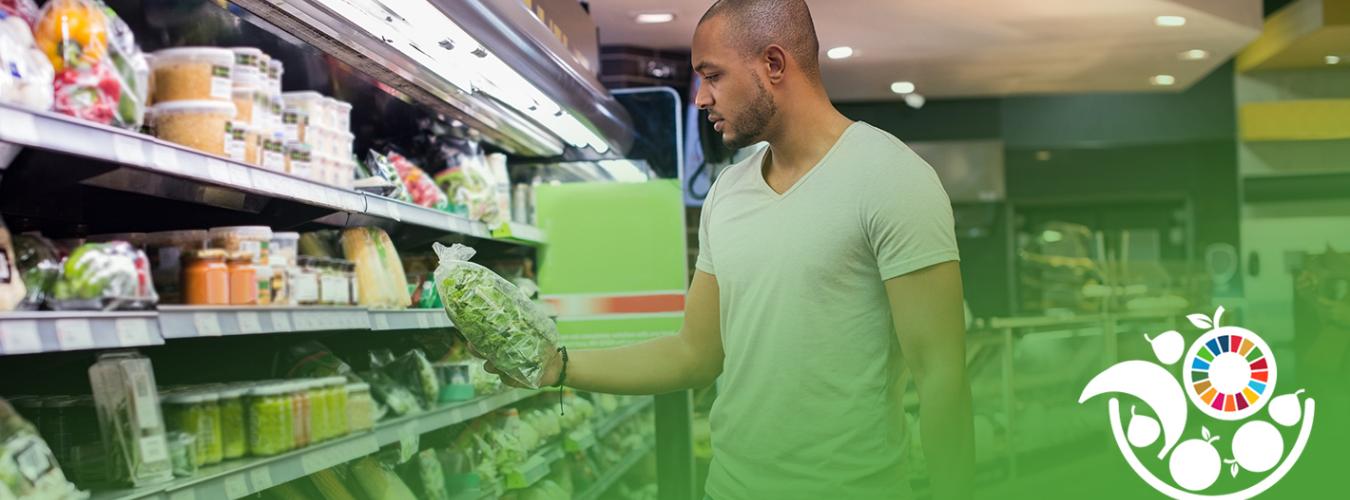 Man buys vegetables at supermarket