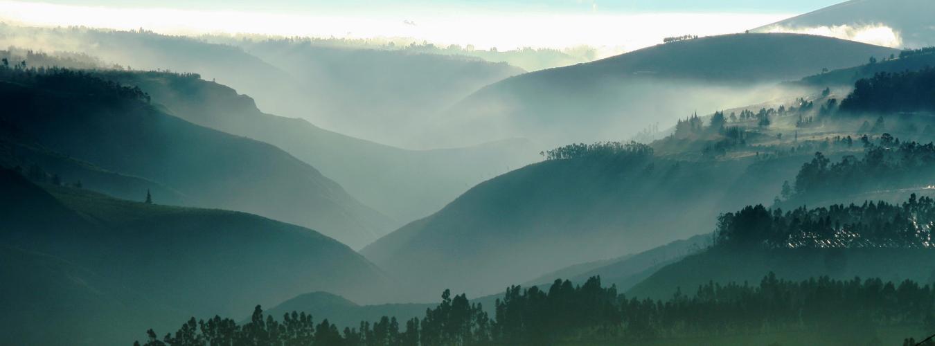 View of a mountain range with hazy lighting. 