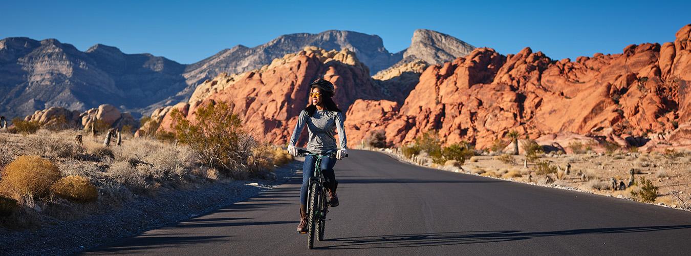 Woman on bike on a road