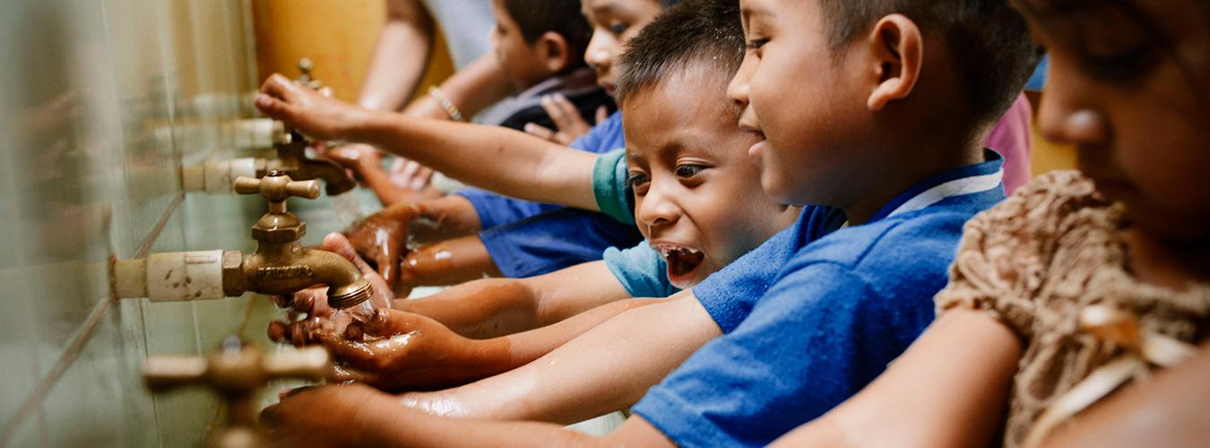 Kids washing their hands