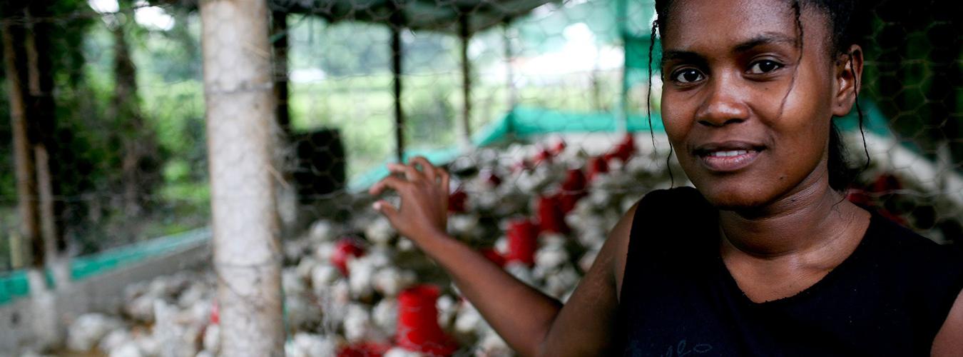 Women in front of a poultry farm