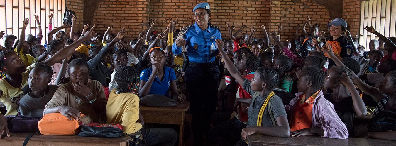  A Cameroonian UN Police Officer from MINUSCA conducts a session on gender-based violence at a school in Bangui.