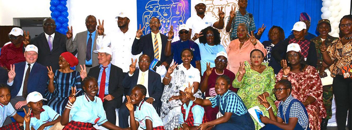 group photo at human rights event in Liberia, featuring officials and youth