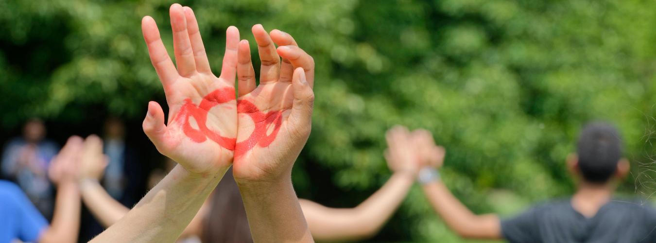 Children's hands raised in the air