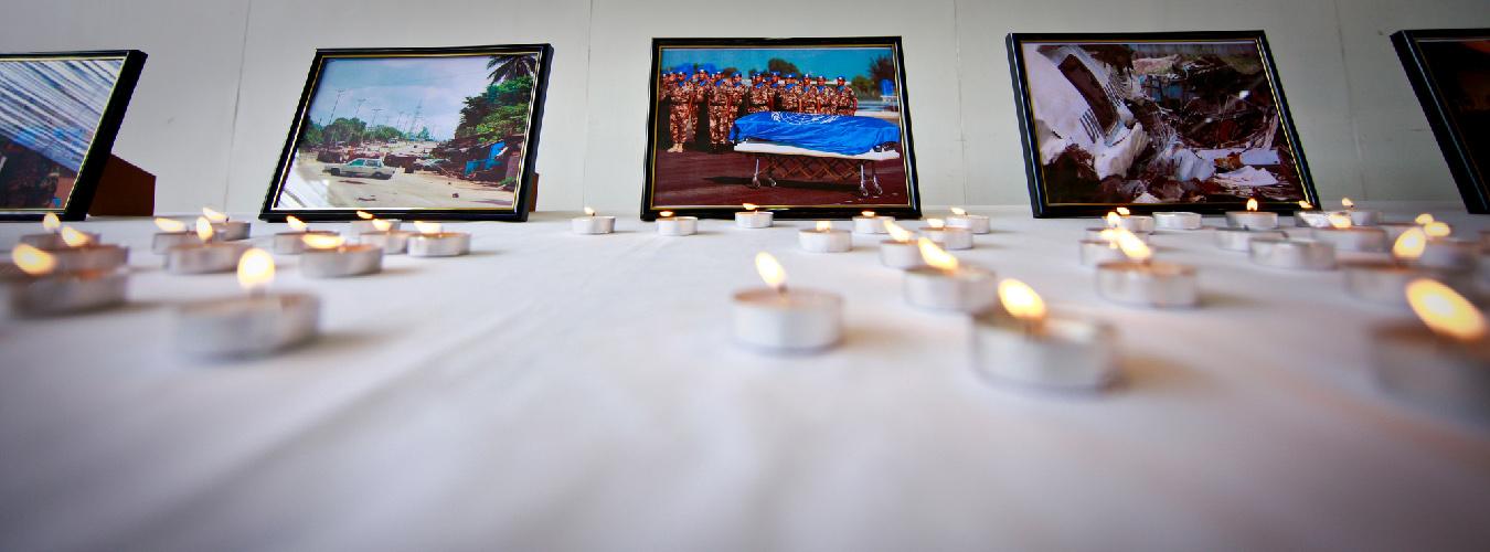 A table with candles and photos
