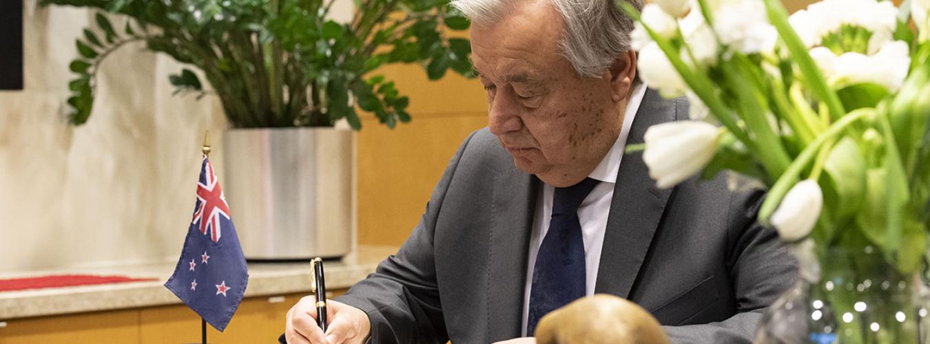 Secretary-General António Guterres signs the book of condolences