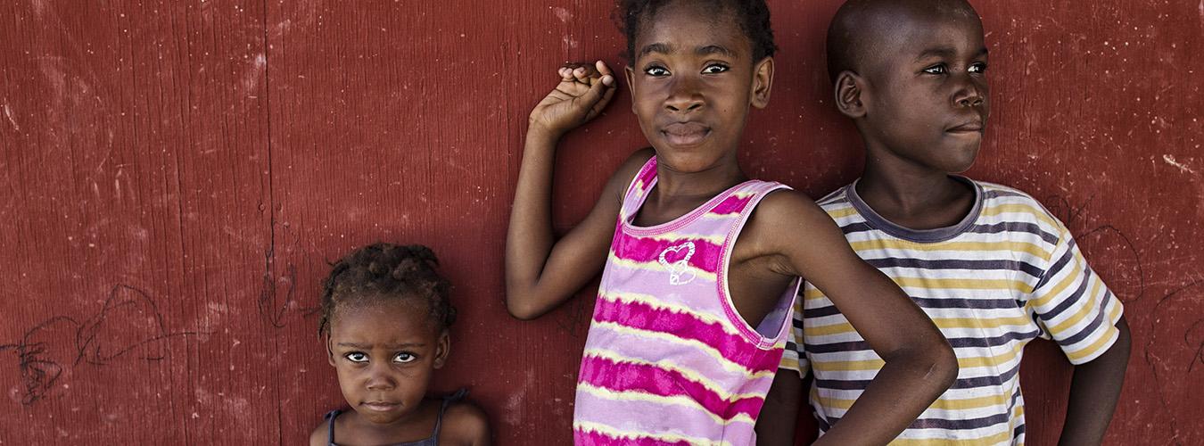 Children pose in a camp for internally displaced people (IDPs) in Haiti.