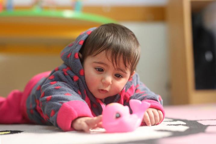 baby playing with toy